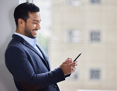 Buy stock photo Office window, phone and happy asian businessman with social media, search or web scroll on work break. Smartphone, rain or consultant with app in China for crm deal, chat or b2b client communication