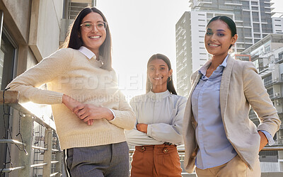 Buy stock photo Cropped portrait of three attractive young businesswomen standing on an office balcony
