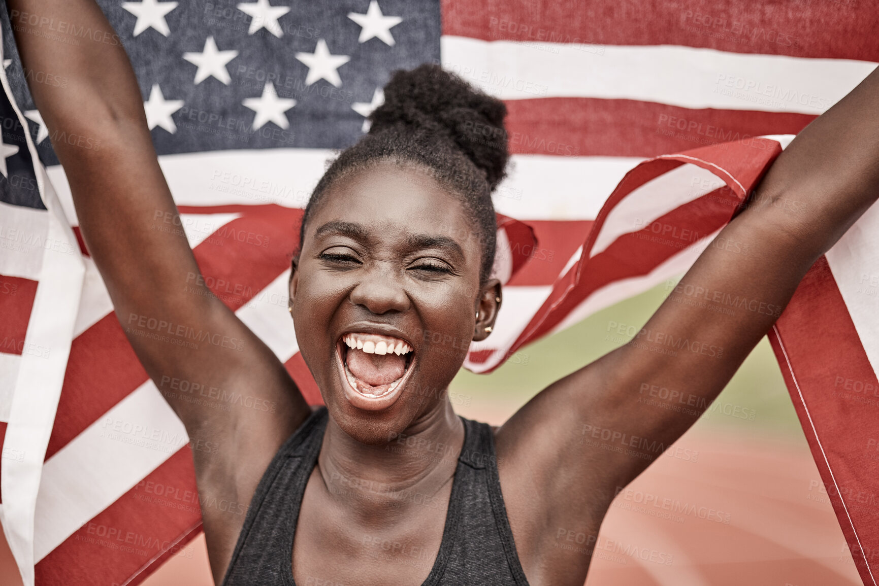 Buy stock photo Shot of a young female athlete celebrating her win while running with a flag