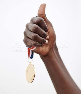 Buy stock photo Shot of an athlete holding the medal that she won