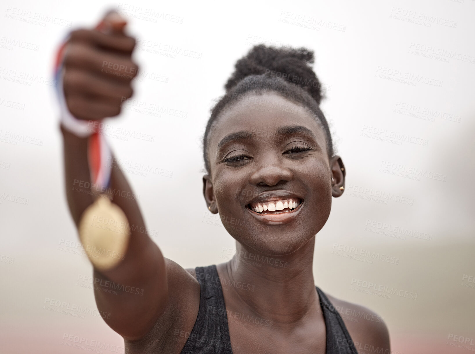 Buy stock photo Shot of an athlete holding the medal that she won