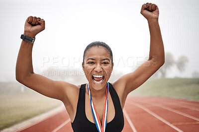 Buy stock photo Shot of a beautiful young female athlete celebrating at the end of her race