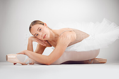 Buy stock photo Full length portrait of an attractive young female ballet dancer in studio against a grey background