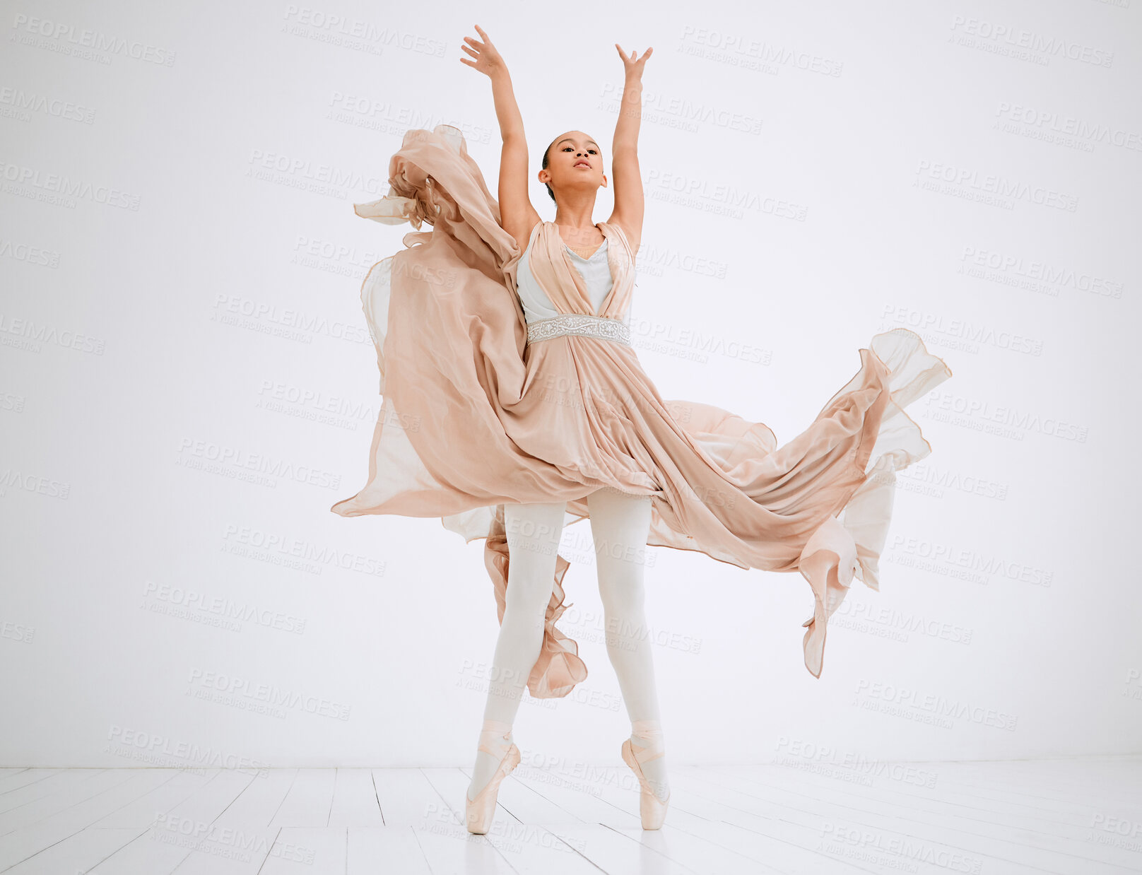 Buy stock photo Full length shot of an attractive young female ballerina practicing in her dance studio