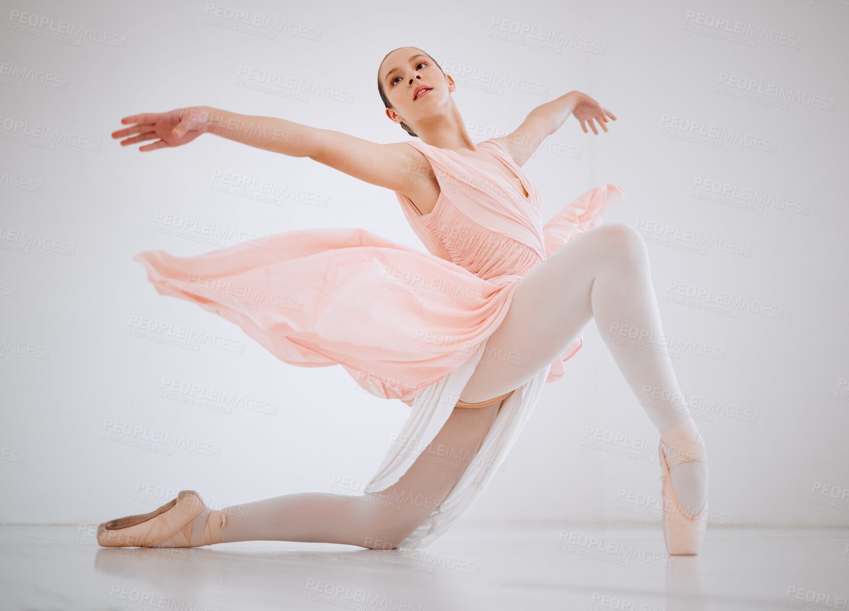 Buy stock photo Full length shot of an attractive young female ballerina practicing in her dance studio