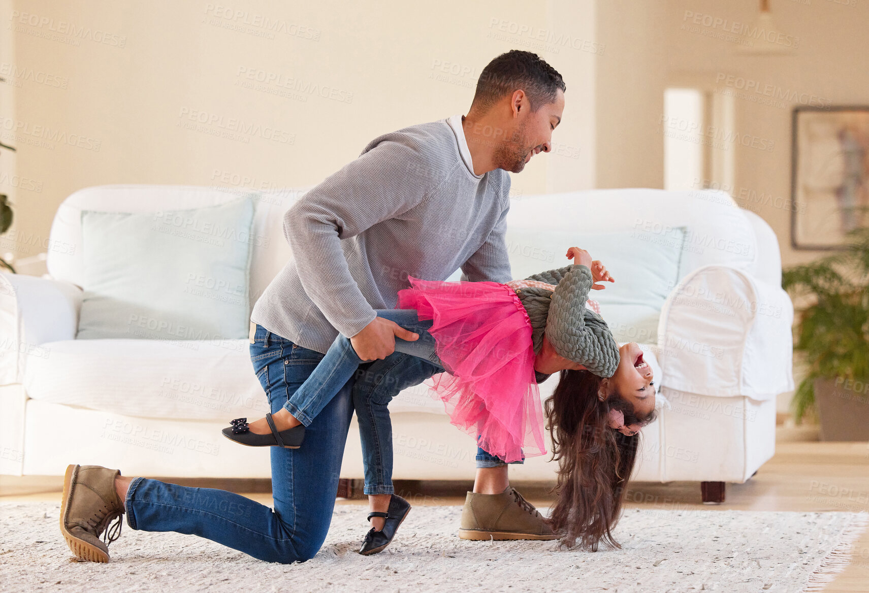 Buy stock photo Shot of a father and daughter dancing together