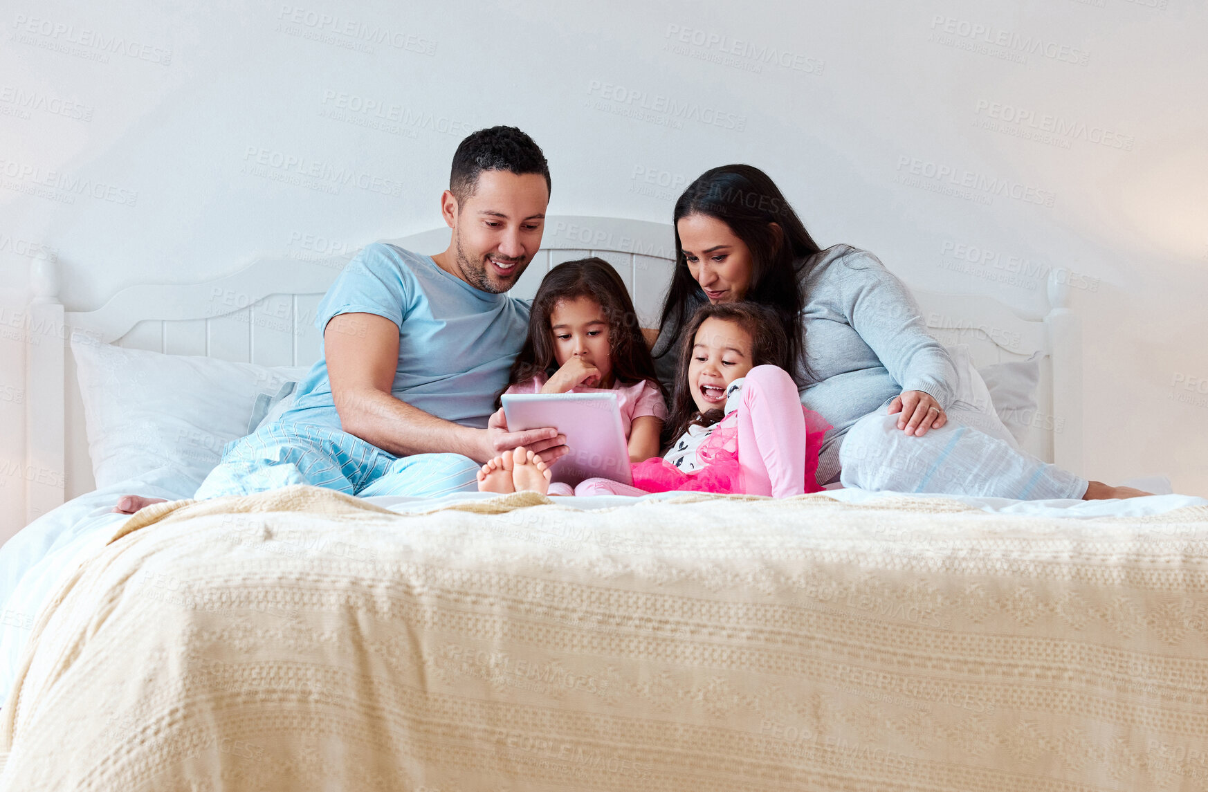 Buy stock photo Family, girls and parents with tablet on bed at home for fun, bonding and care with education. People, daughter and kid with learning on ebook reading for knowledge, information and child growth