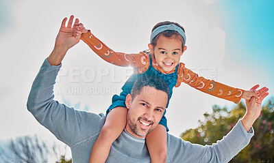 Buy stock photo Shot of a young father and daughter spending time together in a park