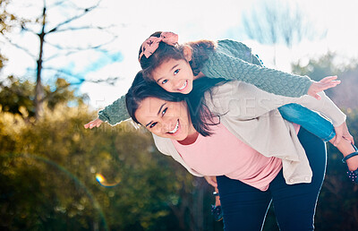 Buy stock photo Shot of a young mother and daughter spending time together in a park