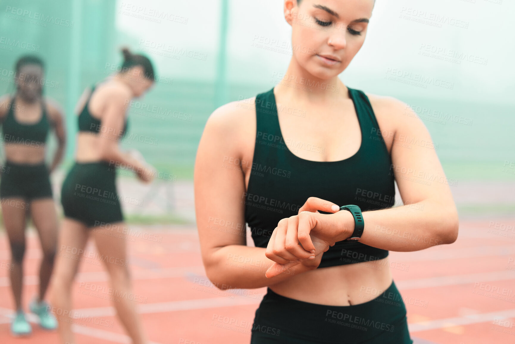 Buy stock photo Running, fitness and woman with watch for time on track for workout, marathon training and exercise. Sports, athlete and runner in stadium with tracker to practice for race, challenge and endurance