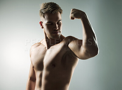 Buy stock photo Muscle, flexing and body of man for workout, health and exercise for training goal on white studio background. Portrait, sports and bodybuilder model with sexy, young and healthy abs from fitness