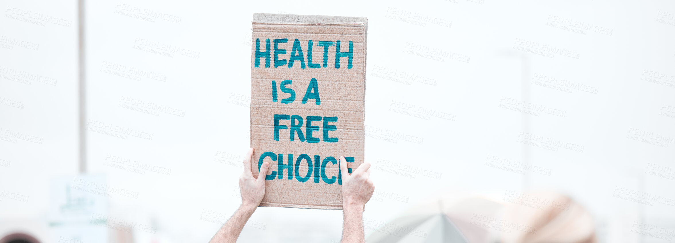 Buy stock photo Person, hands and protest with billboard or sign for health, freedom or choice of anti vaccine on banner. Activist, community or group in rally with poster or board in riot or march for human rights