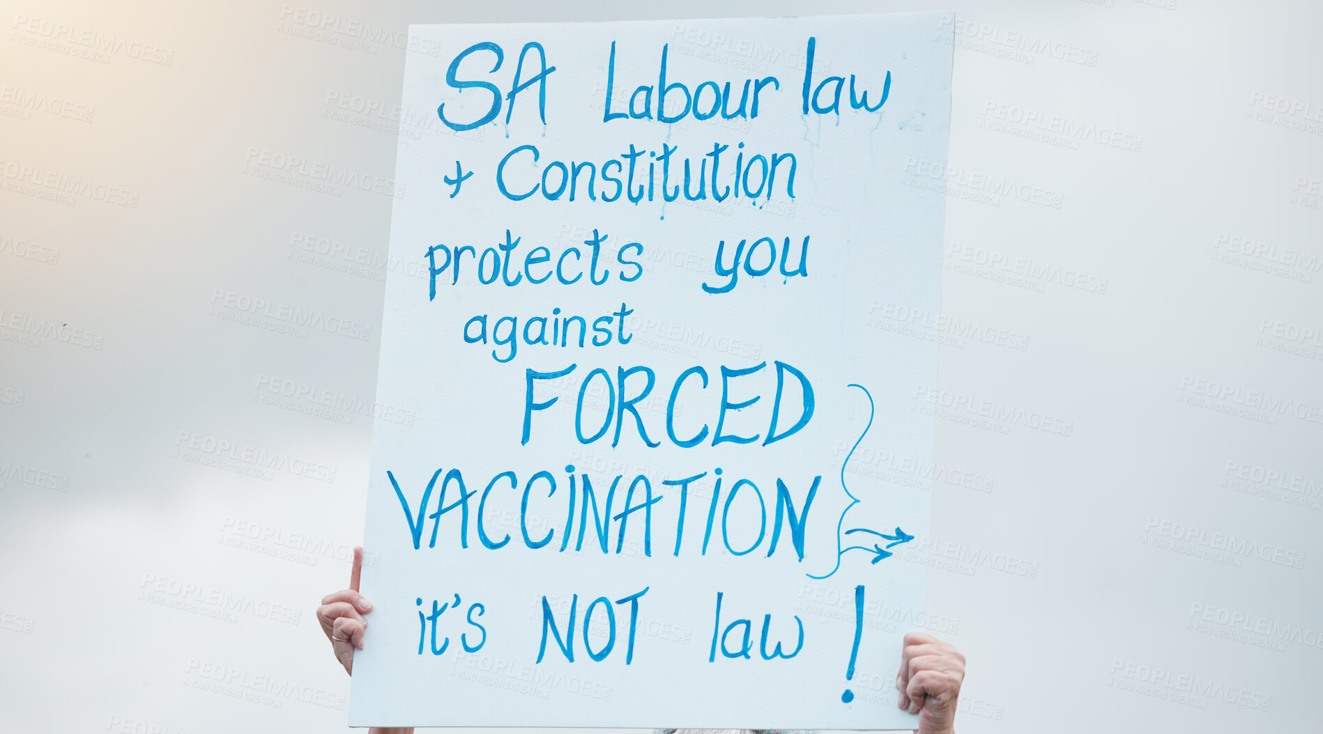 Buy stock photo Hands, poster and protest for vaccine, covid and opinion with sign, medical and human rights in sky. Person, paper and board to stop pharma, choice and decision for health with freedom in street