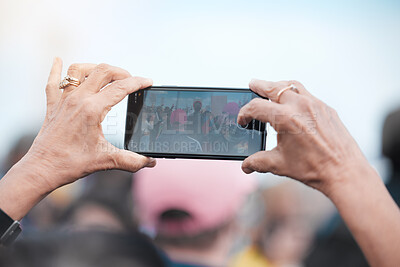 Buy stock photo Hands, phone screen and woman taking photograph outdoor for protest, climate change or global warming. Pov, rally and person with smartphone for pollution, human rights or fight for our planet 