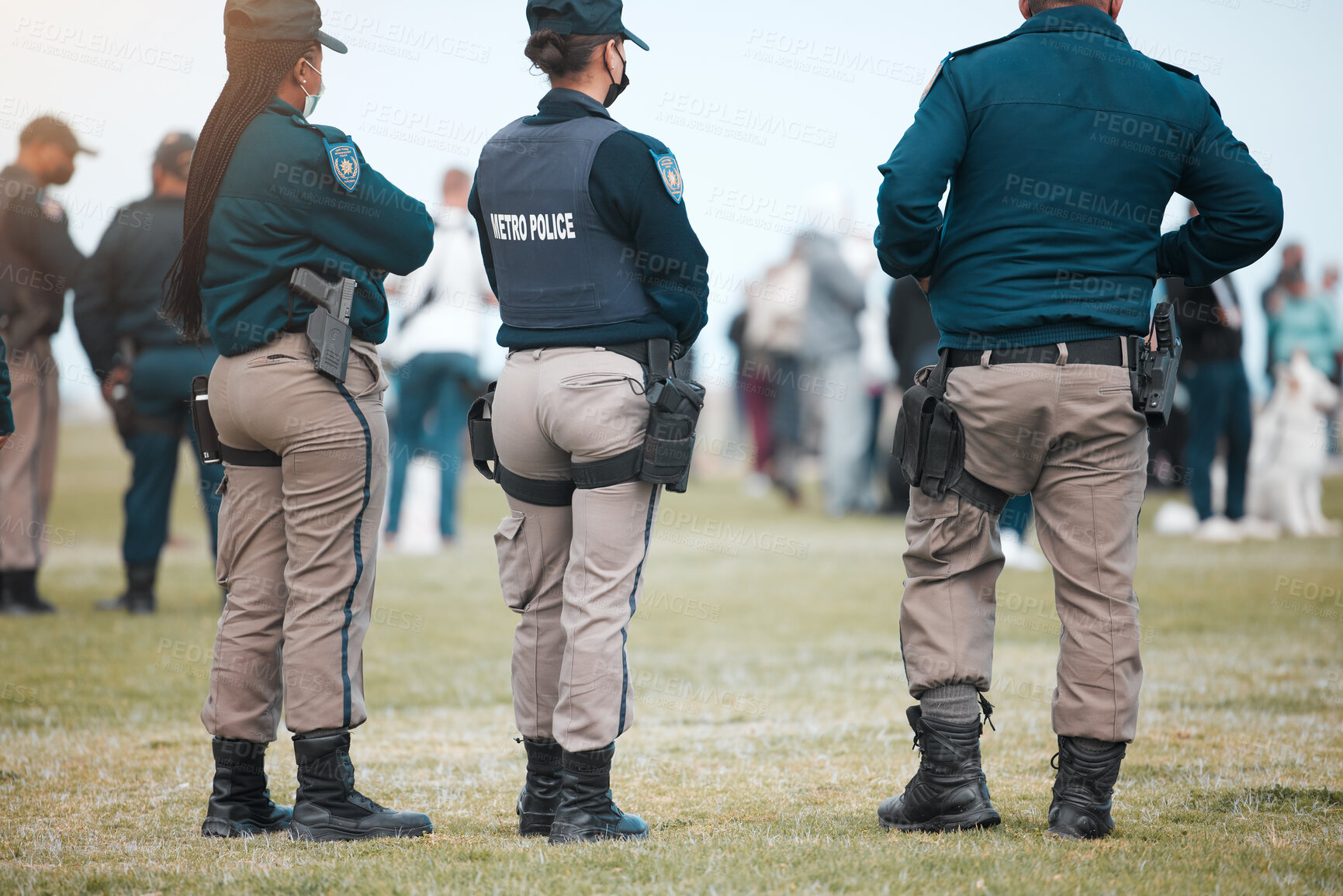 Buy stock photo Security, riot and protest with police officer in park for law enforcement, protection or safety. Brave, uniform and government with people in street for demonstration rally, human rights or control 