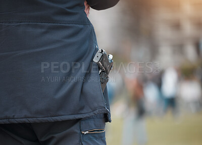 Buy stock photo Police, person and gun with back at protest with safety, monitor and outdoor for crowd control in city. Security guard, weapon and government agent in road, street and protection for danger at rally