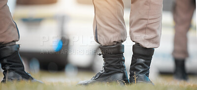 Buy stock photo Group, boots and legs of officer outdoor with safety for protest warning, crime prevention and security team. Uniform, teamwork and zoom of shoes together on grass for justice rally and police foot