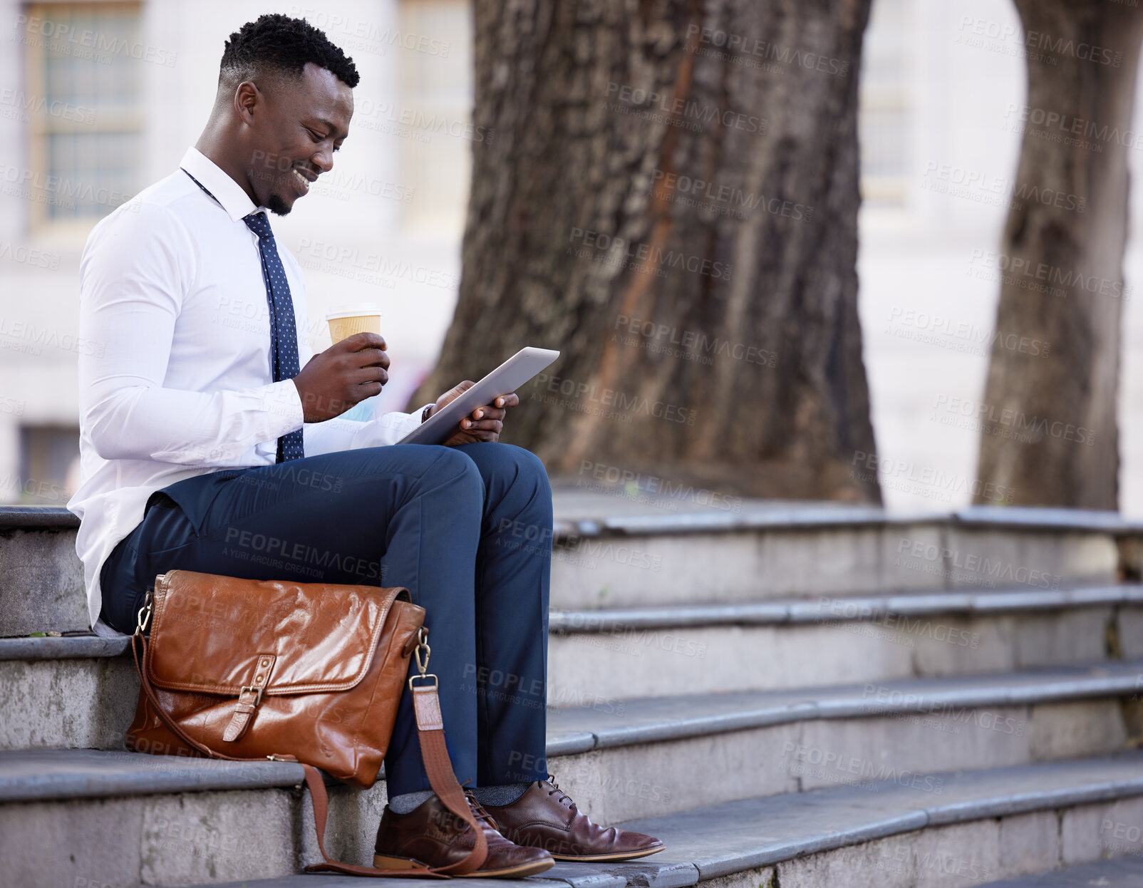 Buy stock photo Coffee, business and black man on tablet in city for research, social media or salesman reading email on steps. Tech, drink and happy professional outdoor on internet, app or website for urban news