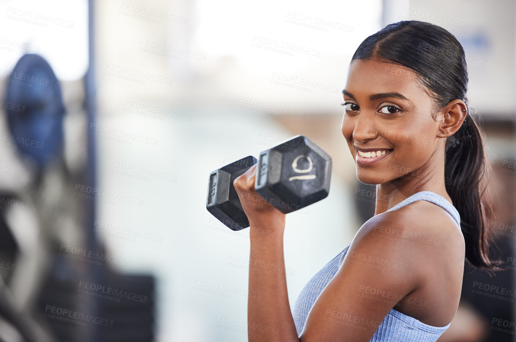 Buy stock photo Portrait of happy woman in gym, dumbbell and mockup for weightlifting, power and muscle at sports club. Balance, fitness and fit female bodybuilder with weights, smile and training with health goals.