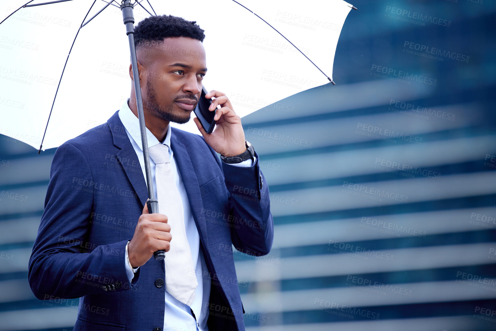 Buy stock photo African business man, phone call and umbrella in city, street and communication on walk, travel and winter. Black businessman, smartphone chat and rain in urban metro, cbd and contact for networking
