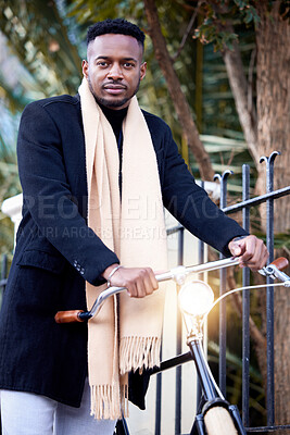 Buy stock photo Portrait, business and black man with bicycle for travel, eco friendly transport or agent cycling to commute. Serious, professional and bike at park outdoor for winter journey with scarf in London