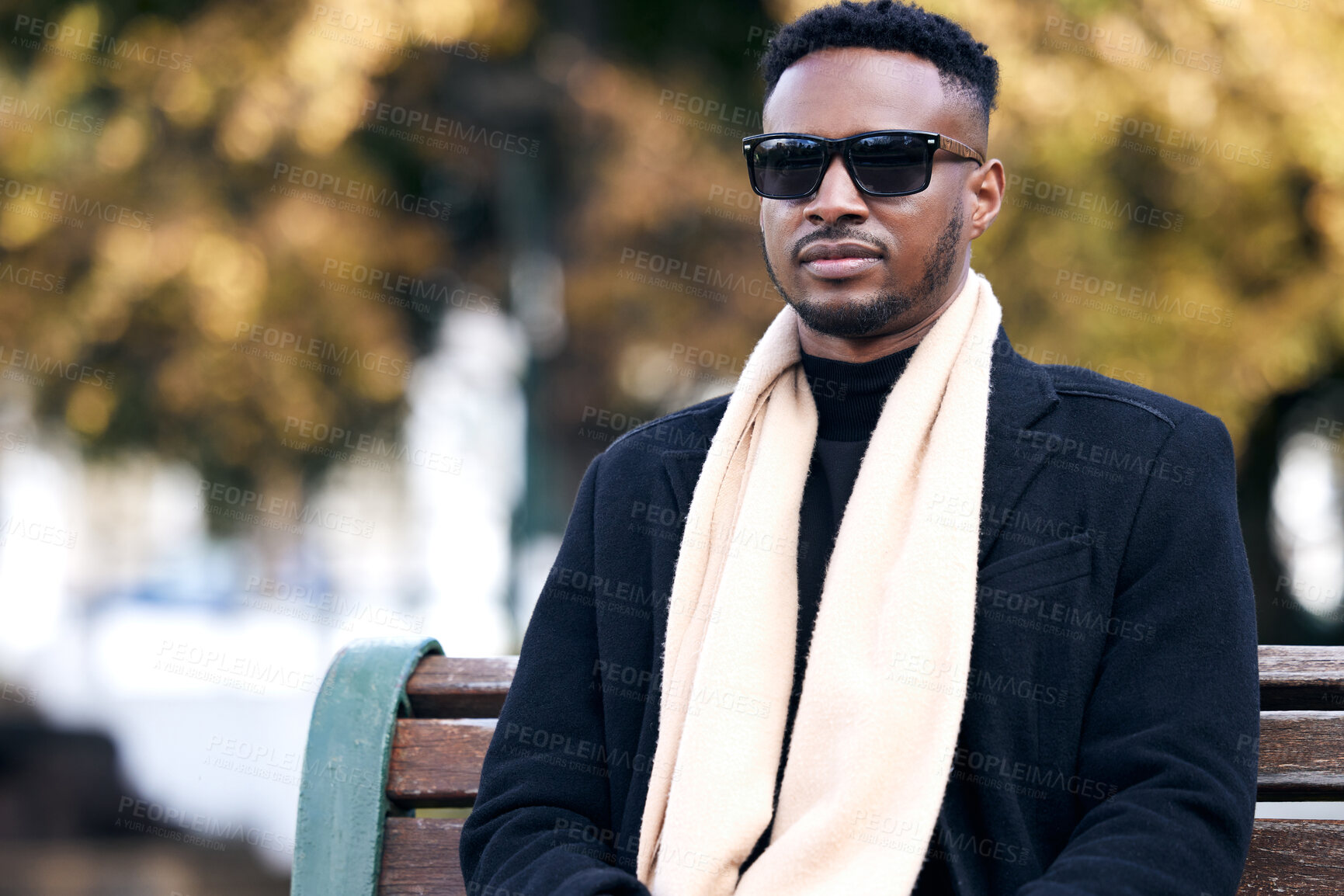 Buy stock photo Portrait, fashion and black man on bench, park and relaxing with business owner, confidence and funky eyewear. Face, African person and entrepreneur with sunglasses, trendy clothes and casual outfit