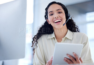 Buy stock photo Portrait of a young call centre agent using a digital tablet while working in an office