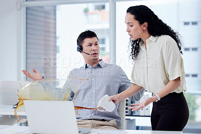 Buy stock photo Shot of a businesswoman spilling a cup of coffee over a colleague's desk in a call centre