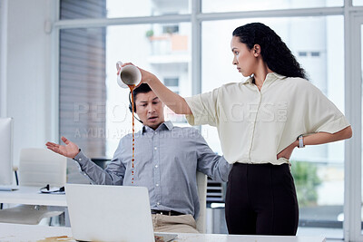 Buy stock photo Shot of a businesswoman pouring a cup of coffee over a colleague's desk in a call centre