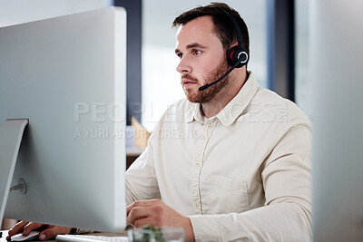 Buy stock photo Customer service, man with a headset and computer at desk of his modern office workplace. Telemarketing or online communication, support or crm and male call center agent at his workstation.
