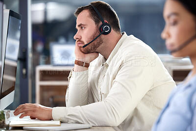 Buy stock photo Mental health, man with headset and computer at his desk in a modern office at workplace. Telemarketing or online communication, customer service and male call center agent bored at his workstation
