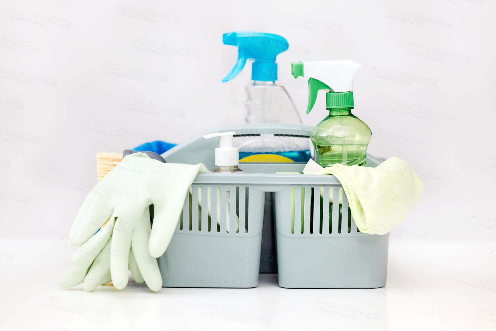 Buy stock photo Cleaning, white background and basket with product for hygiene, disinfection and bacteria for maid service. Housekeeping, spring clean and wash tools with detergents, spray bottle and glove in studio