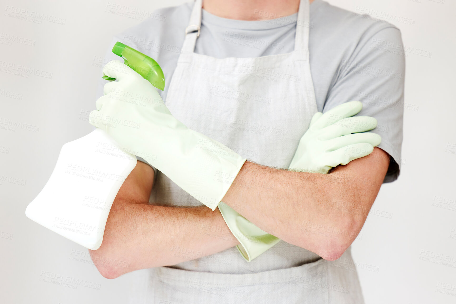 Buy stock photo Man, hands and cleaner or gloves with arms crossed in studio with spray bottle for spring cleaning, bacteria and housekeeping. Person, chemical liquid and hygiene for housework on white background 