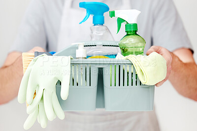 Buy stock photo Shot of an unrecognisable man holding a basket full of cleaning supplies