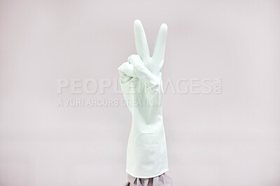 Buy stock photo Person, cleaner or hands for peace sign in gloves for good job with mockup space on grey background. Studio, cleaning or housekeeper showing satisfaction, support gesture or emoji for great service