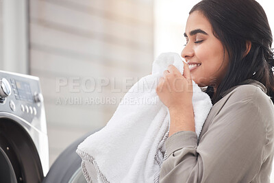 Buy stock photo Smelling, cleaning or happy woman with laundry, machine and home for clothes, fabric and housekeeping. Scent, female person and cleaner washing items in laundromat with routine, smile and service 