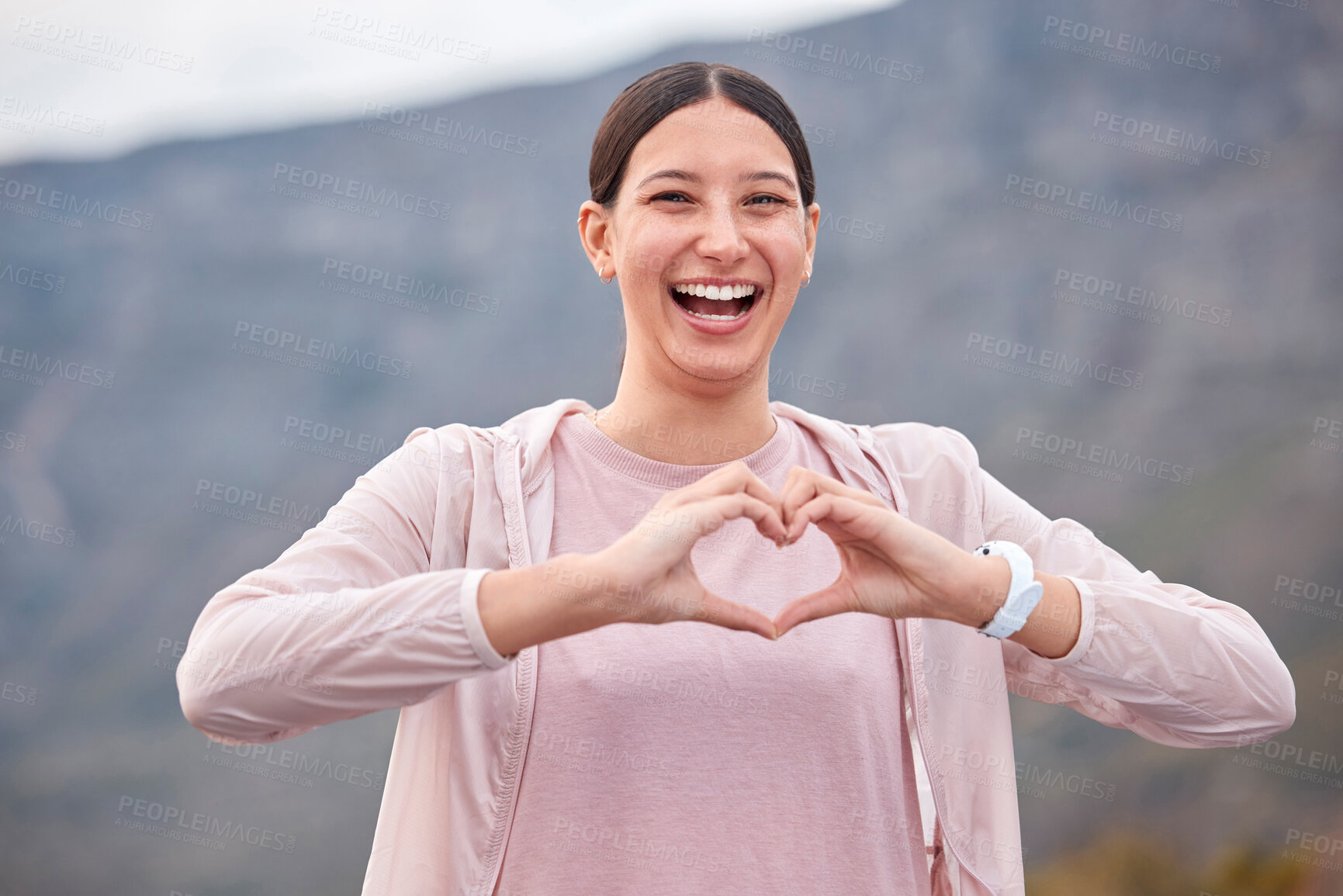 Buy stock photo Smile, fitness and woman with heart hands for exercise in nature for race or marathon training. Happy, sports and portrait of female athlete runner with love emoji gesture for workout by mountain.