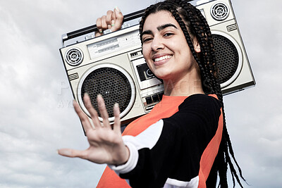 Buy stock photo Cropped portrait of an attractive young female dancer standing with her boombox against a stormy backdrop