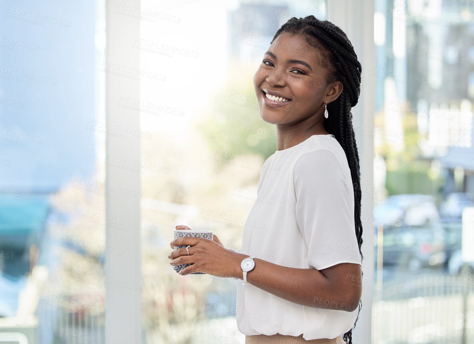 Buy stock photo Shot of a young businesswoman having a cup of coffee at work