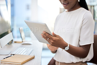 Buy stock photo Shot of an unrecognizable businesswoman using a digital tablet at work