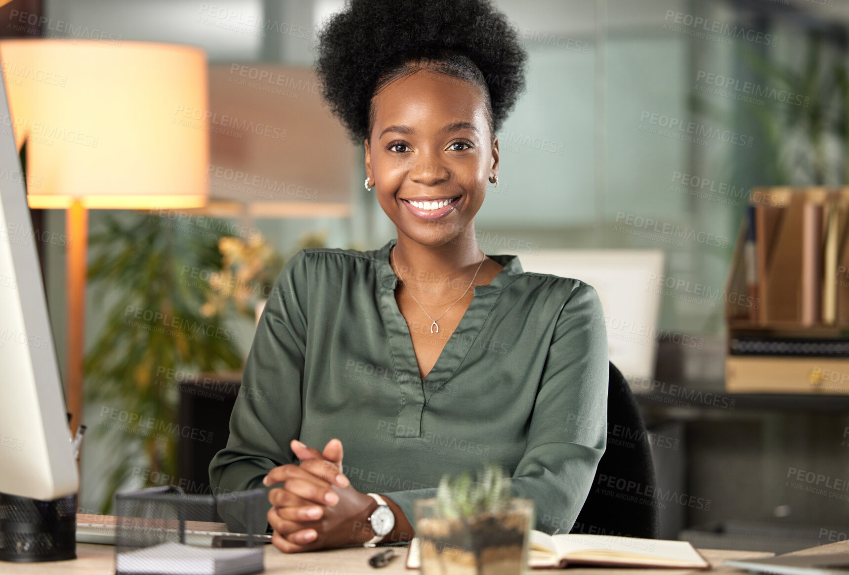 Buy stock photo Cropped portrait of an attractive young businesswoman working at her desk in the office