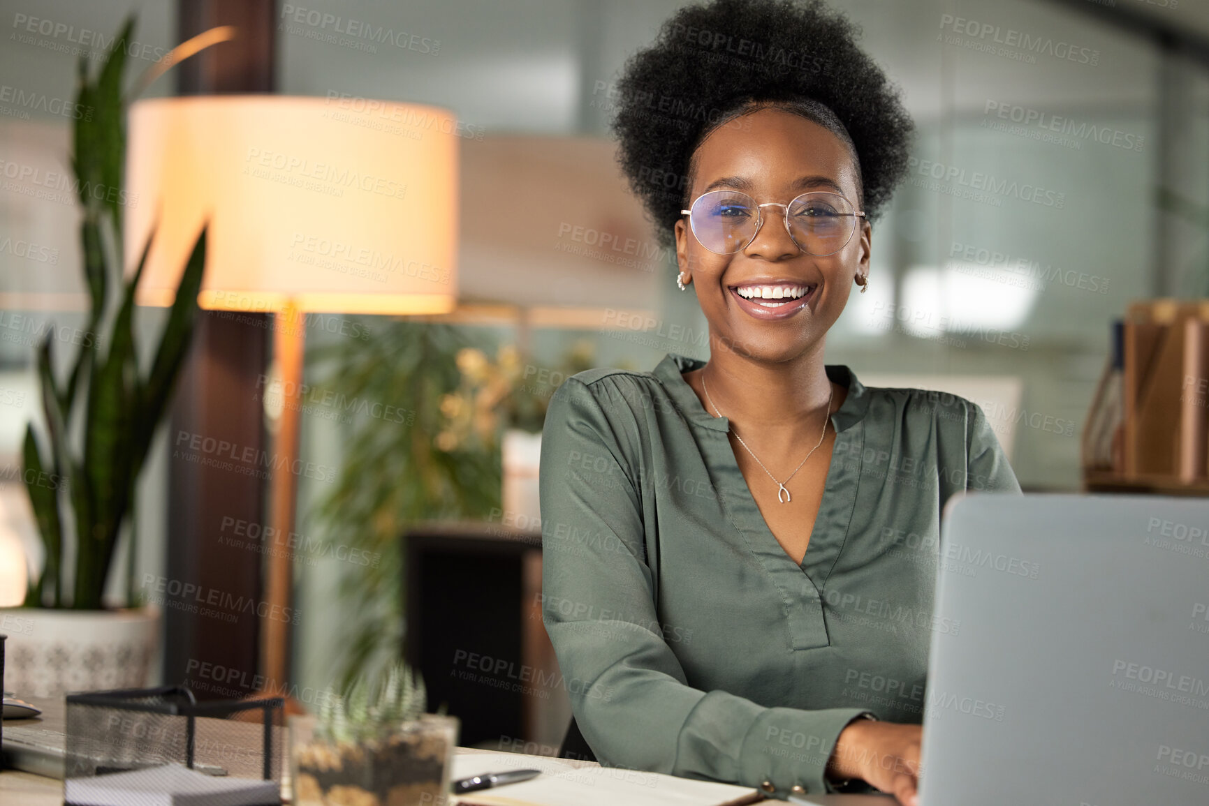 Buy stock photo Cropped portrait of an attractive young businesswoman working on her laptop in the office