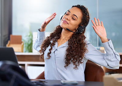 Buy stock photo Cropped shot of an attractive young female call center agent looking relaxed while working at her desk in the office