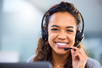 Buy stock photo Cropped portrait of an attractive young female call center agent working at her desk in the office