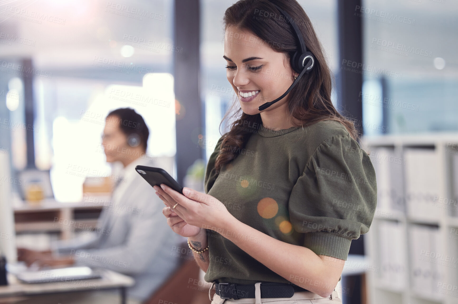 Buy stock photo Woman, phone and headset with microphone in callcenter or customer care with smile and positivity. Female person, consultant and agent for telecommunication, company and workplace on technology