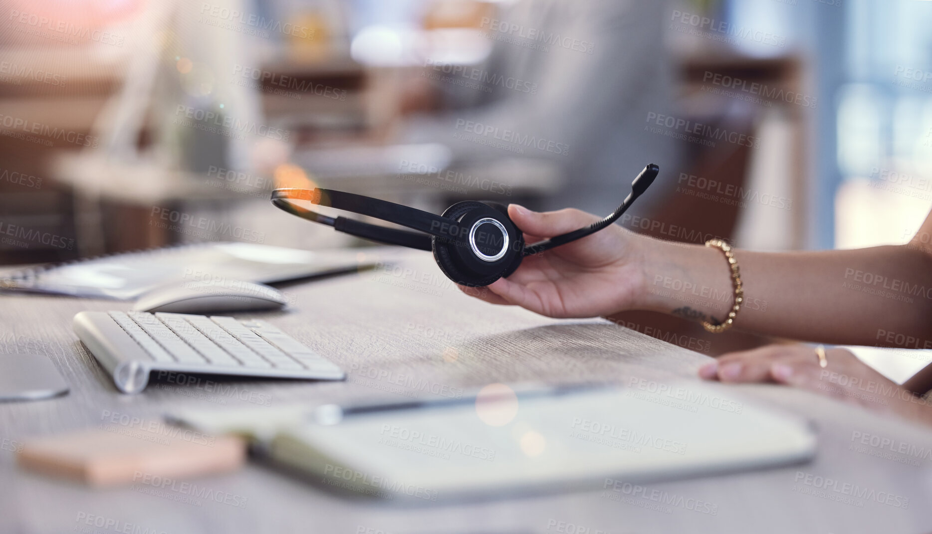 Buy stock photo Hand, holding headset and call center with table, finished and done for working day or shift. Customer service person, headphones and contact us support with crm, hotline and startup telecom employee