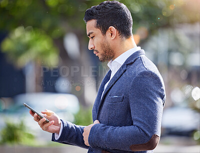 Buy stock photo Phone, typing and serious businessman on street checking email, feedback or online chat outside. Networking, communication and man in city checking mobile app on smartphone for business connection.