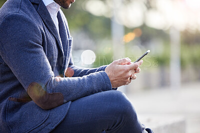 Buy stock photo Hands, business man and phone in town for contact, travel and internet for networking in outdoors. Male person, commute and typing on app for conversation, lawyer and website for research planning