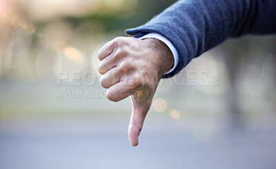Buy stock photo Shot of a businessman giving the thumbs down
