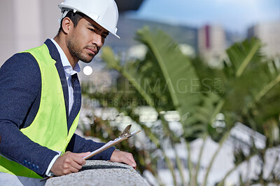Buy stock photo Man, engineer and clipboard for inspection at building site for management, serious and pride. Male person, project leader and hardhat in Abu Dhabi for construction, architecture and development